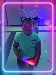 a girl smiling with LED lights